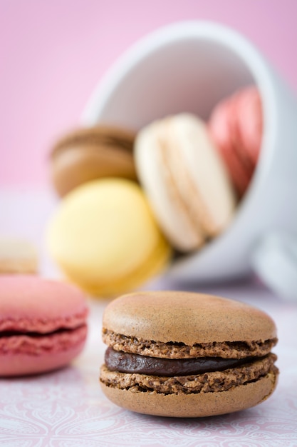 Colorful macarons in a vintage bowl