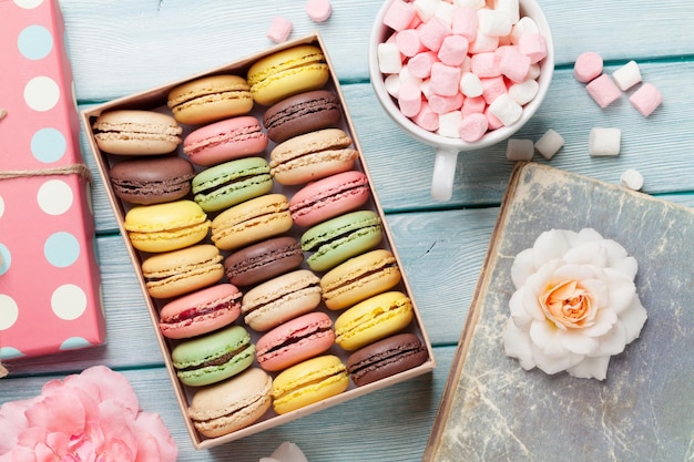 Colorful macaroons in a box and marshmallow