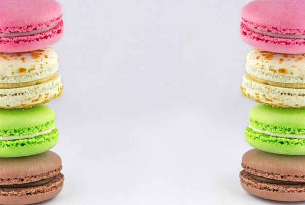 Colorful macaroons in a columns on the sides