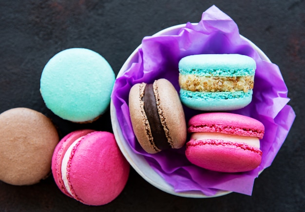 Colorful macaroons on dark