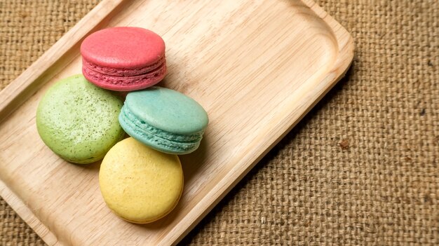 Colorful macaroons on gray background.