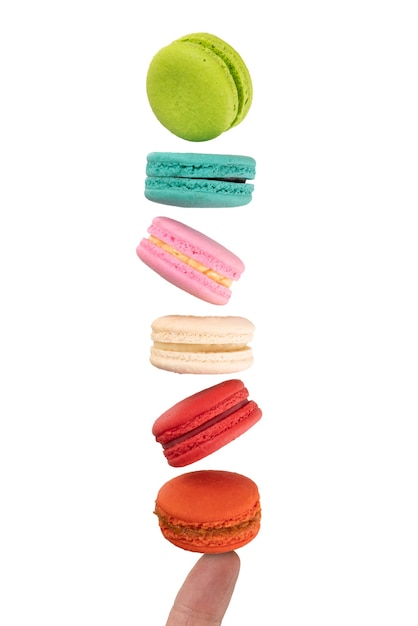 Colorful macaroons levitating on a finger. Levitation food photography concept.