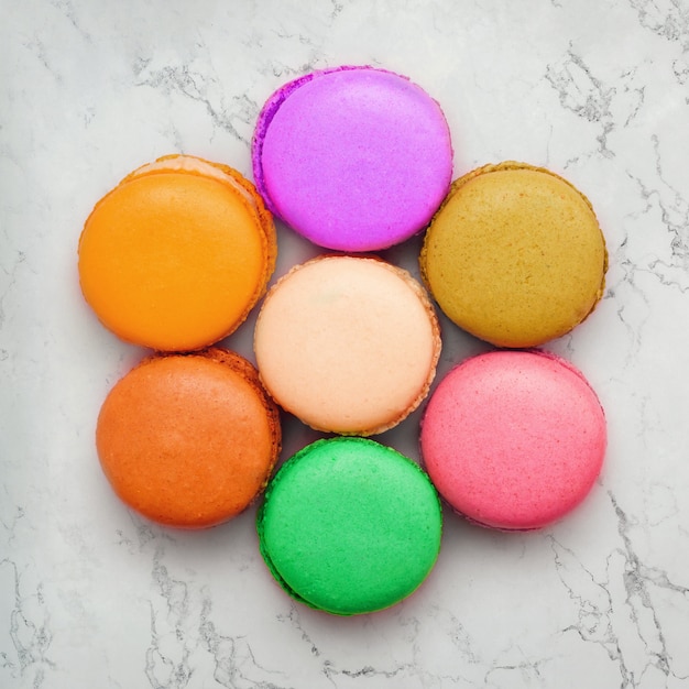 colorful macaroons on marble background