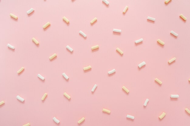 Colorful marshmallow pattern on pink