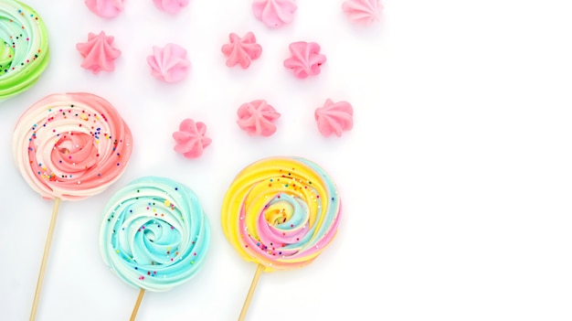 Colorful meringue lollipop on a white background.