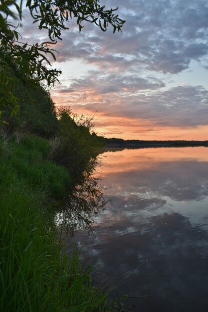 Colorful and misty dawn over a small river