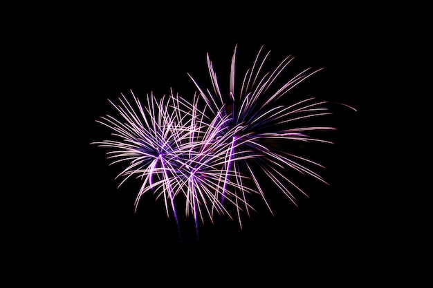 Colorful new year fireworks over dark sky