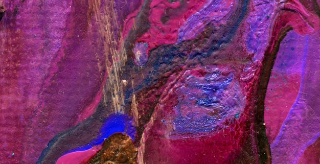 A colorful painting of a rock with the word love on it