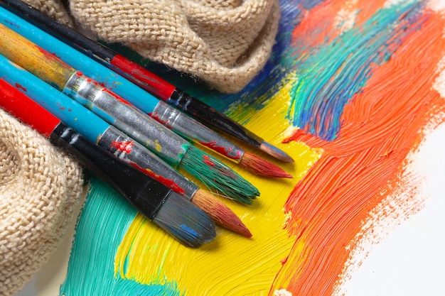 A colorful painting with a red and blue paint brush on it.