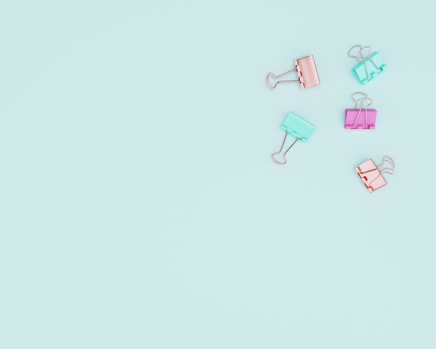 colorful paperclips in teal background