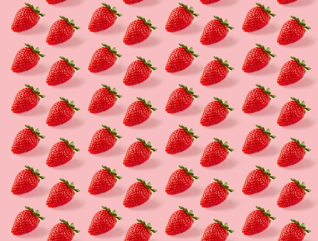 Colorful pattern of strawberries on pink background. Top view, repeat, isometric wallpaper