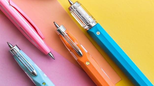 a colorful pen sits next to a colorful pen