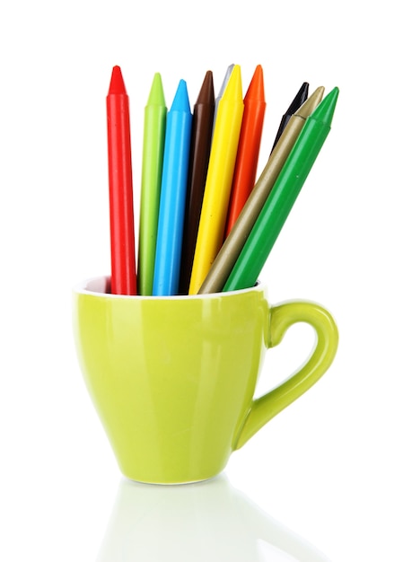 Colorful pencils in cup on white