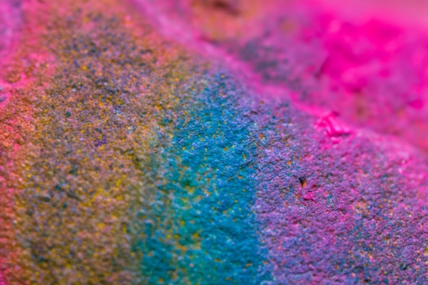 Photo a colorful piece of art is covered in colorful powder.