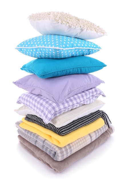 Colorful pillows and plaids isolated on white