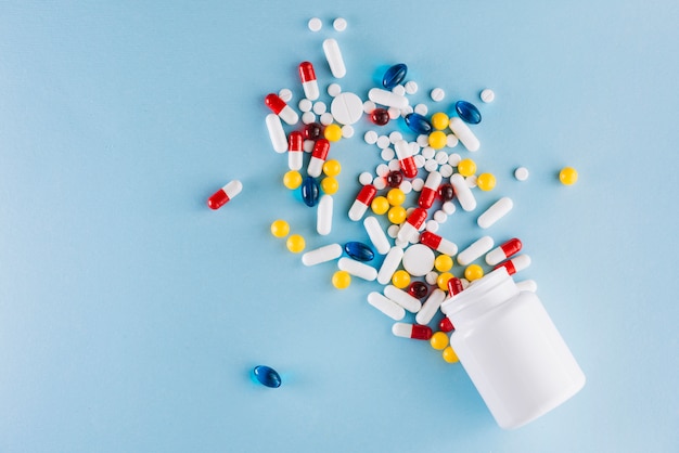 Colorful pills and plastic bottle