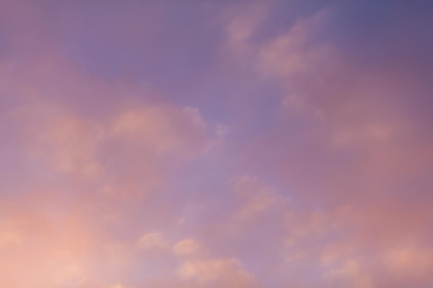 Colorful pink clouds in the sky at sunrise or sunset