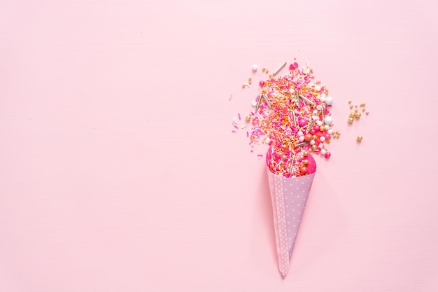 Colorful pink sprinkle blend on a pink background.