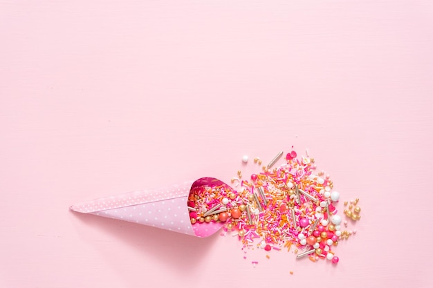 Colorful pink sprinkle blend on a pink background.