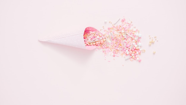 Colorful pink sprinkle blend on a pink background.