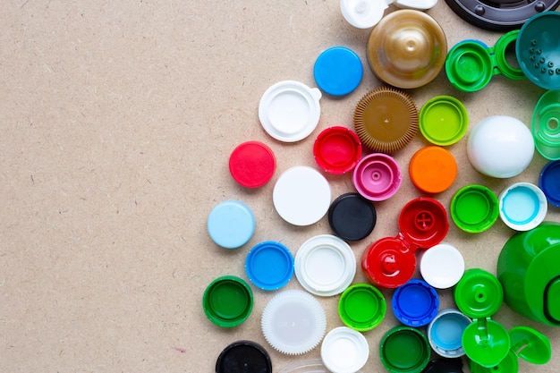 Colorful plastic bottle caps and plastic glass lid