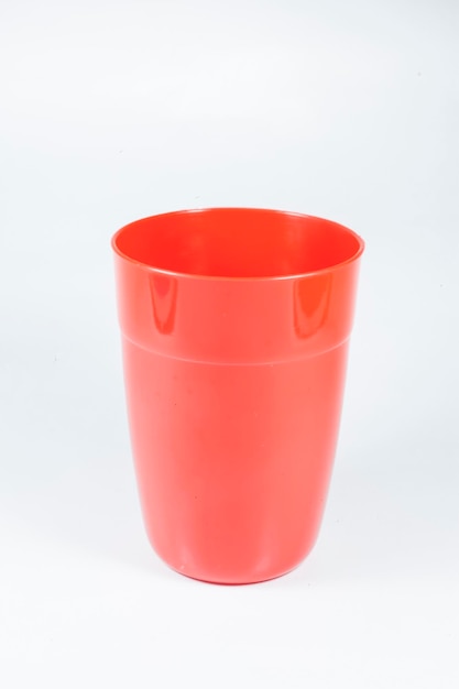 Colorful plastic drinking glasses on a white background