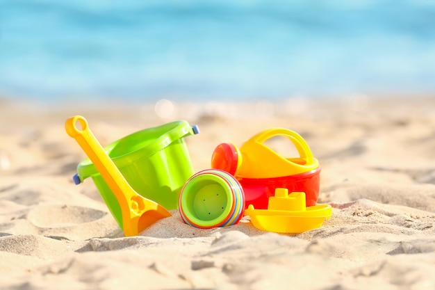 Colorful plastic sand toys on beach