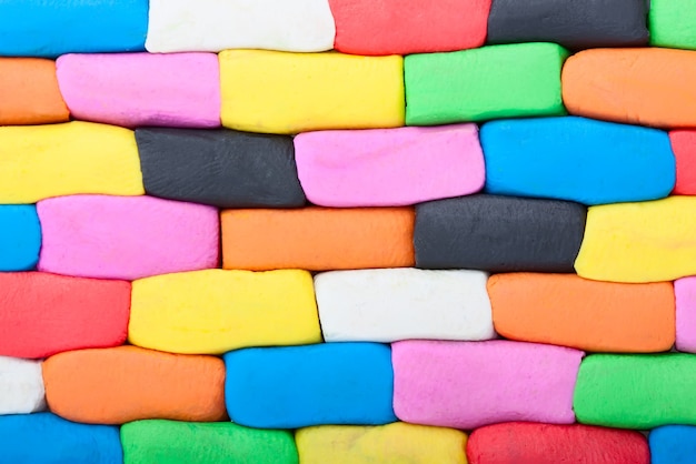 Colorful plasticine wall bricks extreme closeup