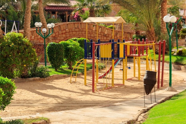 Colorful playground equipment for children in tropical holiday resort