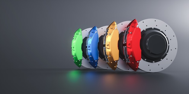 Colorful red yellow blue and green Sport Racing brake discs isolated on gray background 3d rende