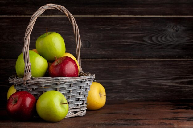 Colorful ripe apple fruits in basket