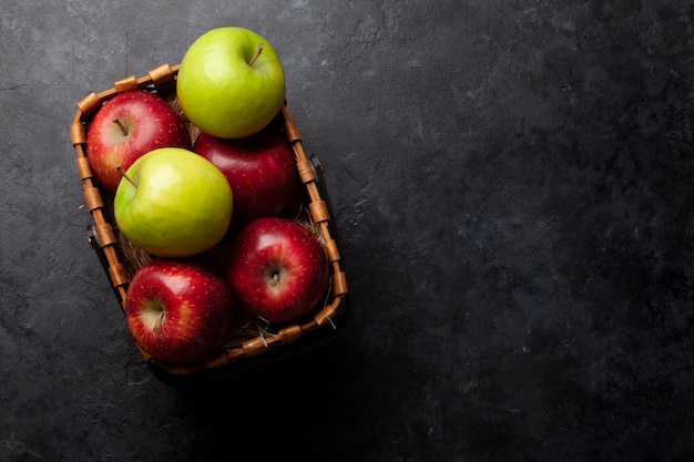 Colorful ripe apple fruits in basket