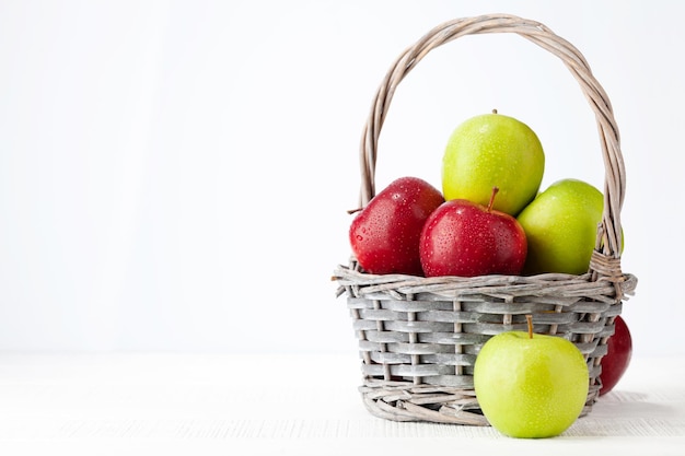 Colorful ripe apple fruits in basket