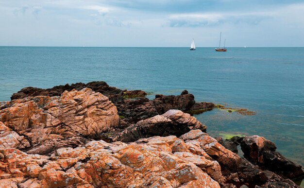 Colorful rock formation around picturesque small town Gudhjem in Bornholm, Denmark