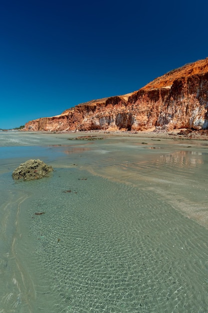 Colorful sand cliffs at the paradisiacal Praia de Vila Nova Icapui Ceara Brazil