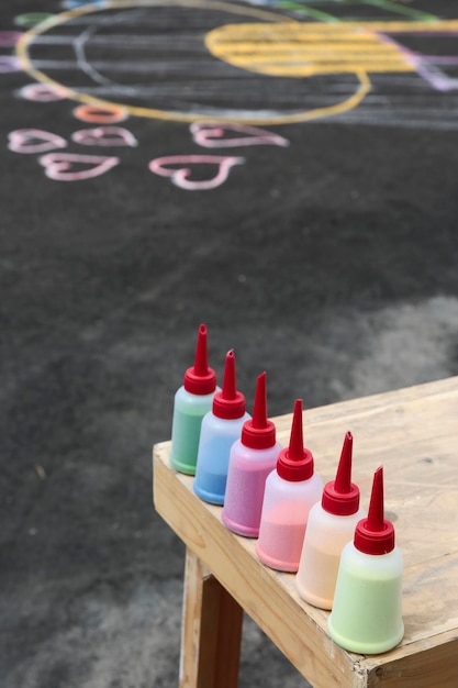 Colorful sand in plastic bottle for sand painting