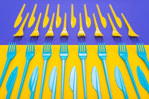 Colorful set of plastic table ware isolated on background