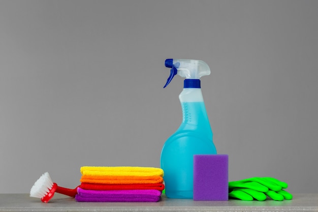 Colorful set of tools for cleaning the house on neutral 