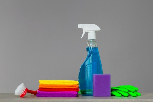 Colorful set of tools for cleaning the house on neutral . 