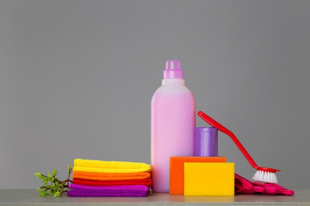 Colorful set of tools for cleaning the house and twigs 