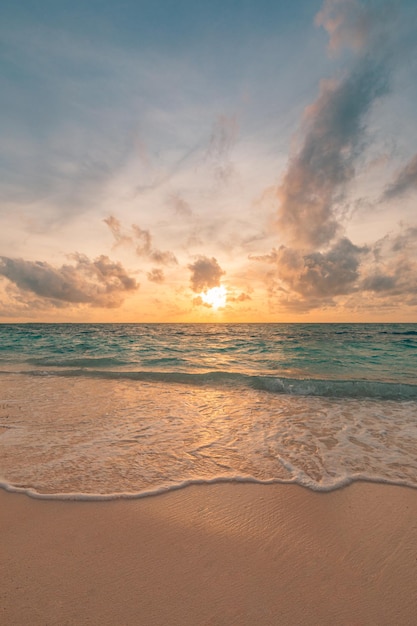 Colorful sky clouds ocean beach sunrise sunset. Vertical tropical island seaside coastal landscape