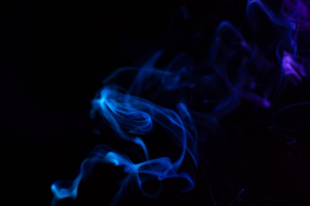 Colorful smoke close-up on a black background