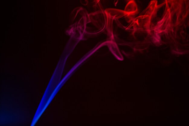 Colorful smoke close-up on a black background