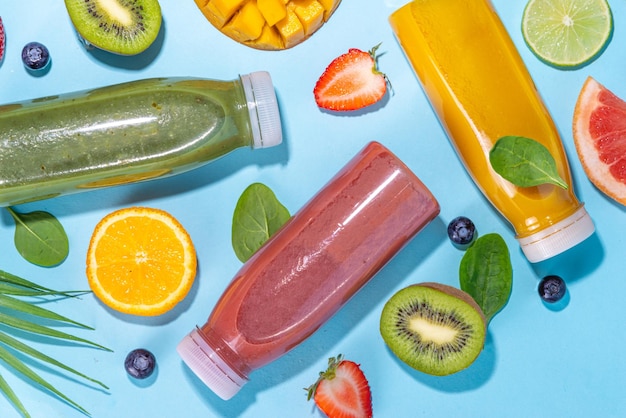 Colorful smoothies in glass bottles