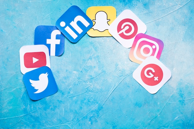 Colorful social media icons on painted blue background