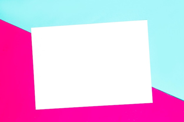 Colorful of soft blue and pink paper background with white paper frame for text