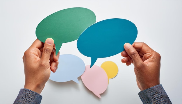 Colorful Speech Bubbles in Hand for Communication and Conversation Concept