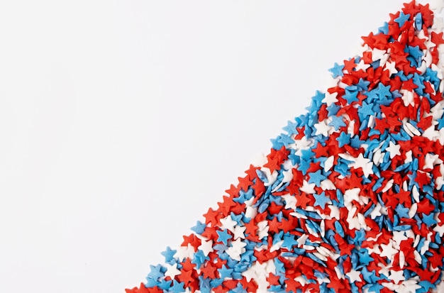 Colorful star shape sprinkes decorations for fourth july copy space