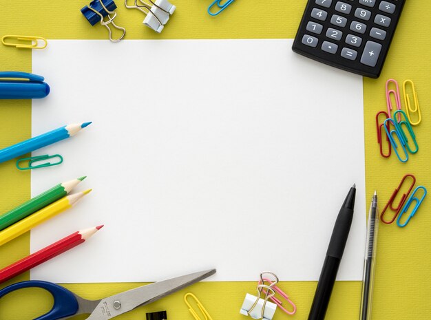 Colorful stationery on yellow background