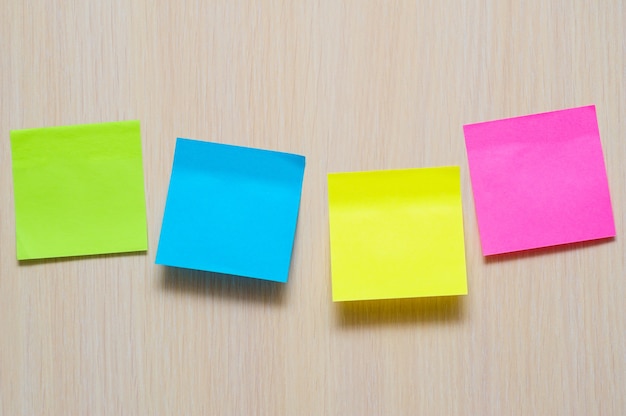 Colorful stickers on the light wall in office with place for text